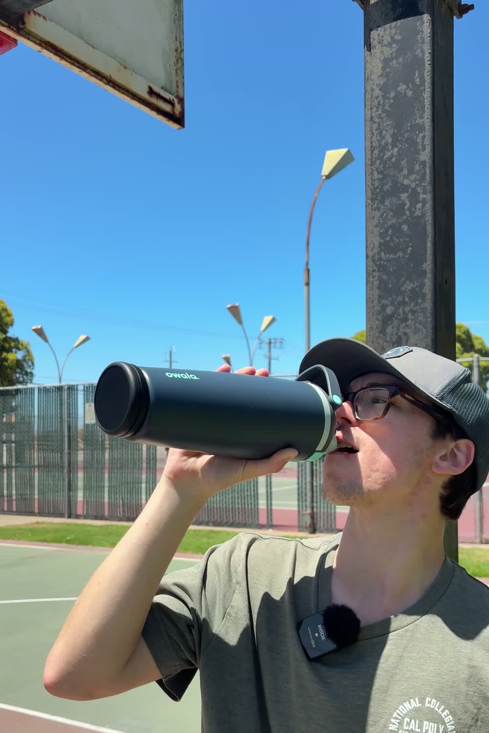 Drinking from a bottle with the Sponge tracker attached, courtside